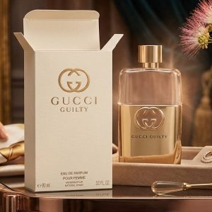 Gucci Perfume Bottle With a Metallic Gold And Peach Design